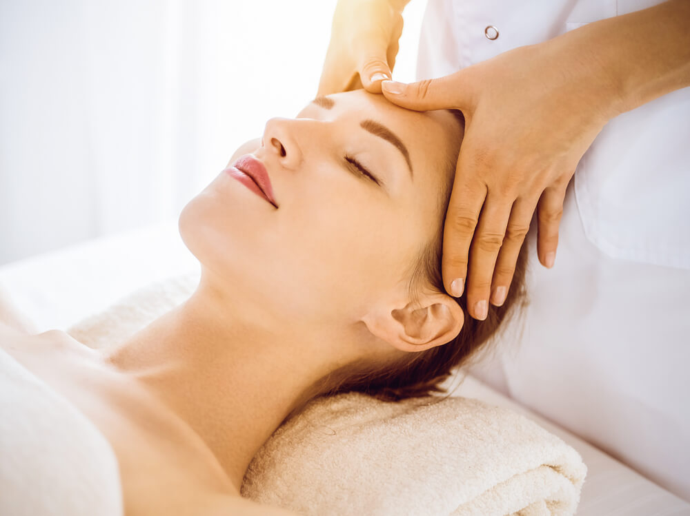 Woman having facial massage