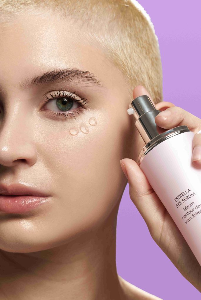 Woman using the Celestolite Estrella Eye Serum