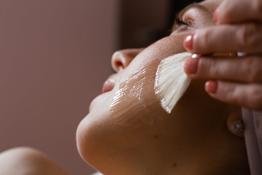 Woman having facial peel