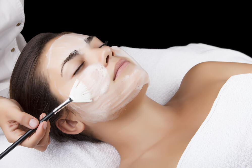 Woman having facial peel