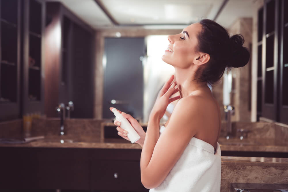 Woman applying neck cream