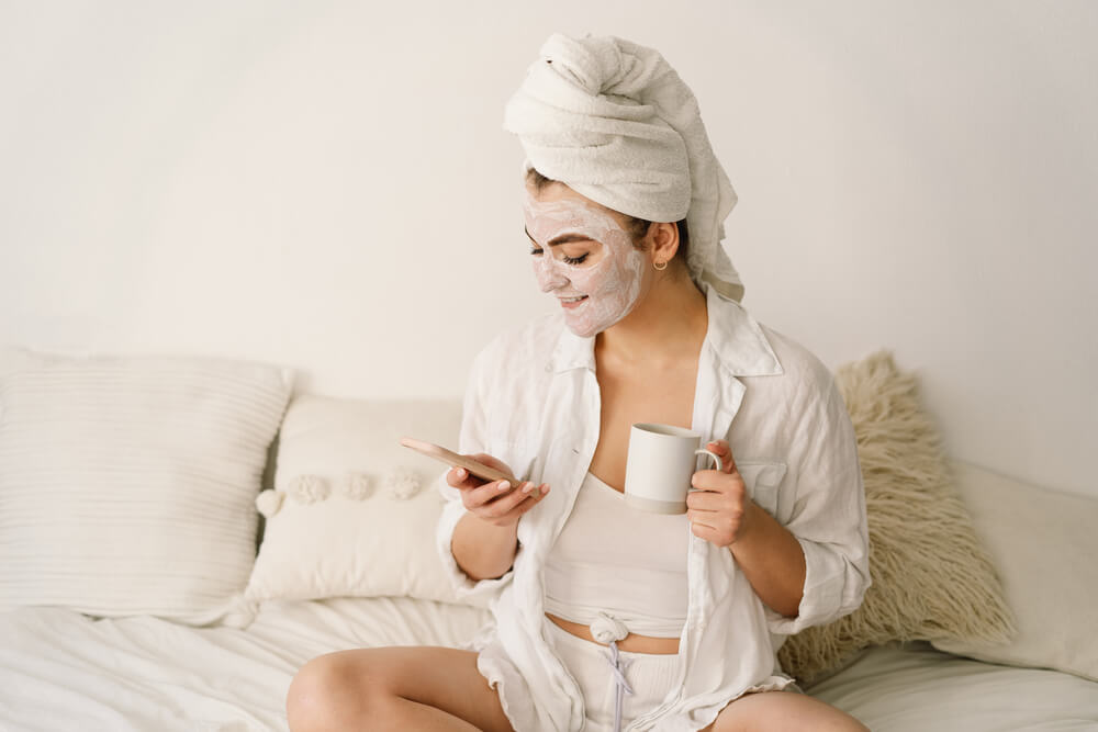 Woman with face mask to treat yourself