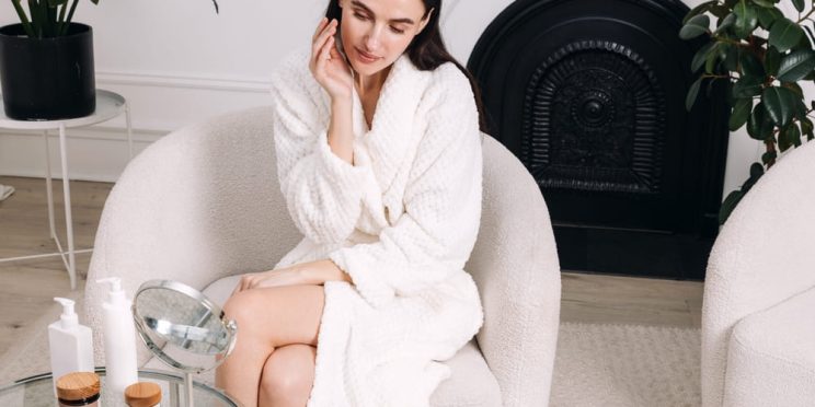 Woman applying skincare