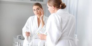 Woman applying skincare product - expiration dates