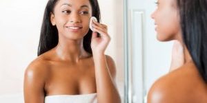 Woman cleansing - New Year’s Resolutions for Your Skin