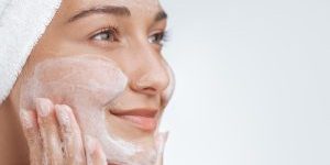 woman double cleansing face