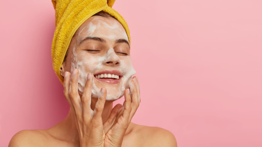 woman washing face